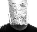 Gray paper bag with sad smiley over head.jpg